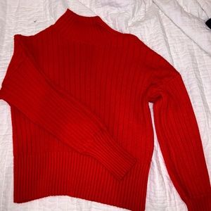 red ribbed style turtleneck sweater